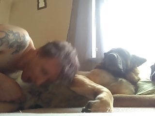 Dude looks sexy while sucking dog's penis greedily